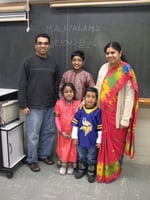 Color image of students in a Malayalam class (level 1) pose for a photograph at the School of India for Languages and Culture (SILC) on Social Studies Day, ca. 2015, in St. Paul.